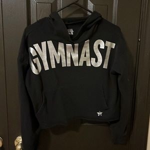 Black cropped hoodie says gymnast in silver letters (rarely used)